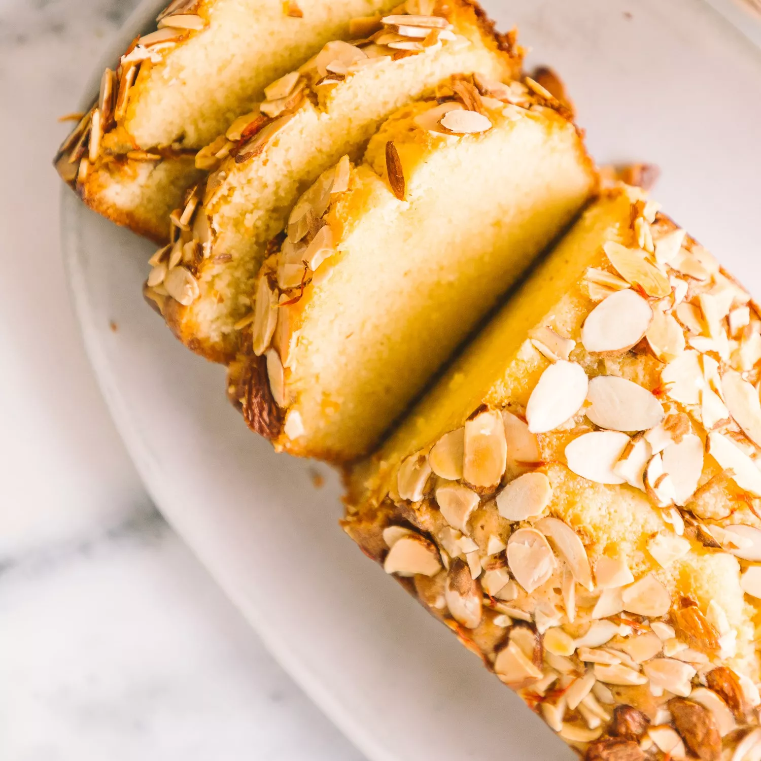 Orange Almond Loaf topped with sliced almonds