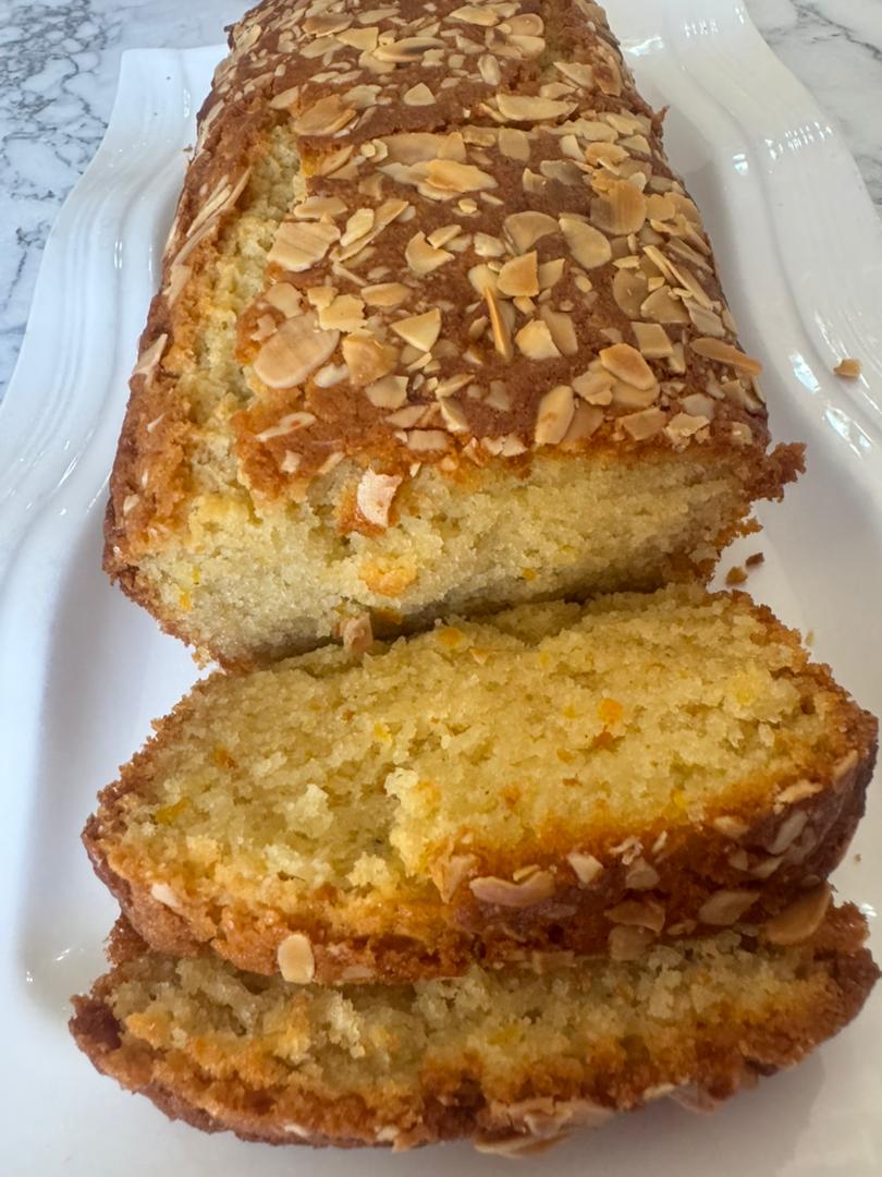 Orange almond loaf with two slices cut